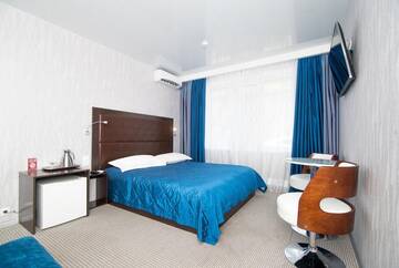 Фото номера Трехместный номер Делюкс Гостиница Boutique Hotel Cruise г. Владивосток 7